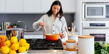woman cooking inside kitchen room