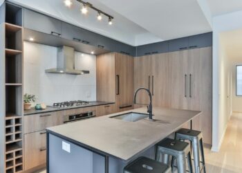 white wooden kitchen cabinet with stainless steel faucet