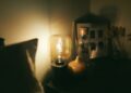 clear glass lamp on black wooden table
